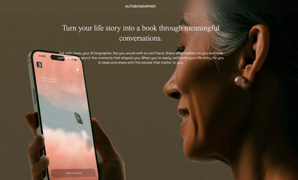 A woman smiling while using the Autobiographer AI app on her smartphone to turn her life story into a book.