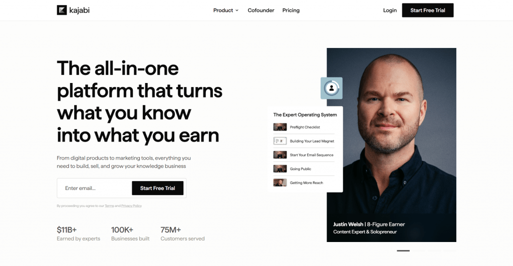 Screenshot of the Kajabi website homepage featuring the headline "The all-in-one platform that turns what you know into what you earn" next to a portrait of solopreneur Justin Welsh.