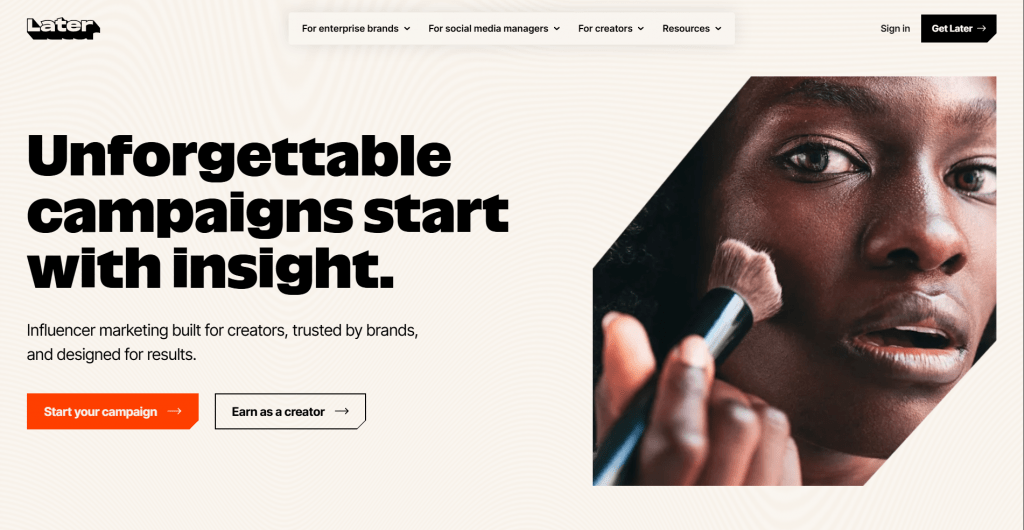 Web page landing screenshot for Later featuring the headline "Unforgettable campaigns start with insight.", call-to-action buttons for starting a campaign or earning as a creator, and a close-up photograph of a person applying makeup with a brush.